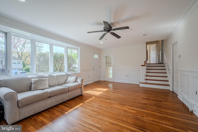 1211 Crestover Rd, Wilmington, DE 19803 - living area with crown molding, wood-type flooring, a decorative wall, and stairway