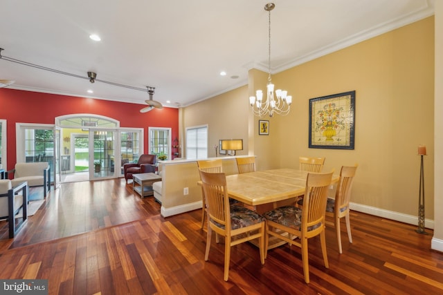 dining space with a wealth of natural light, recessed lighting, crown molding, and hardwood / wood-style flooring
