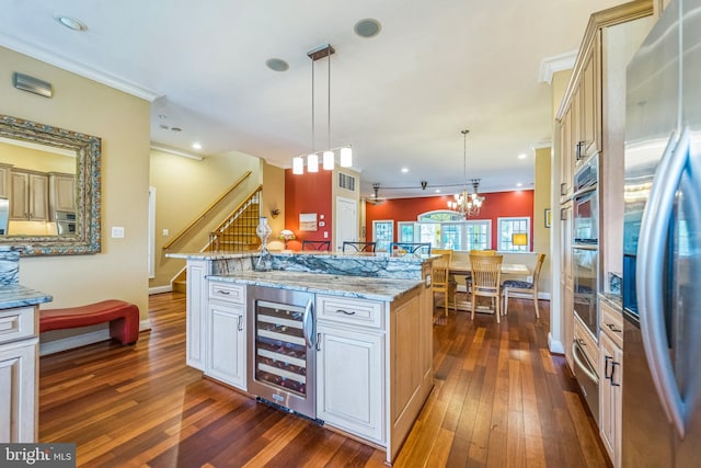 kitchen featuring freestanding refrigerator, dark wood-style flooring, and beverage cooler