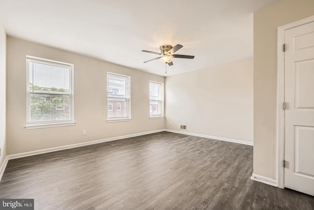 2024 E Baltimore St E, Baltimore, MD 21231 - spare room with dark wood-style floors, ceiling fan, and baseboards