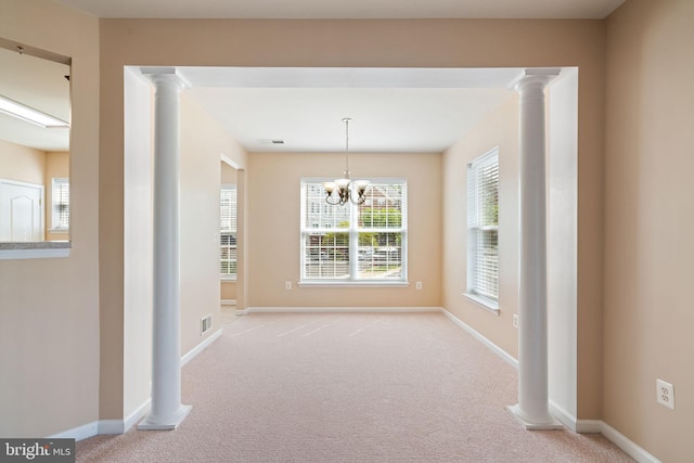 unfurnished dining area with visible vents and carpet