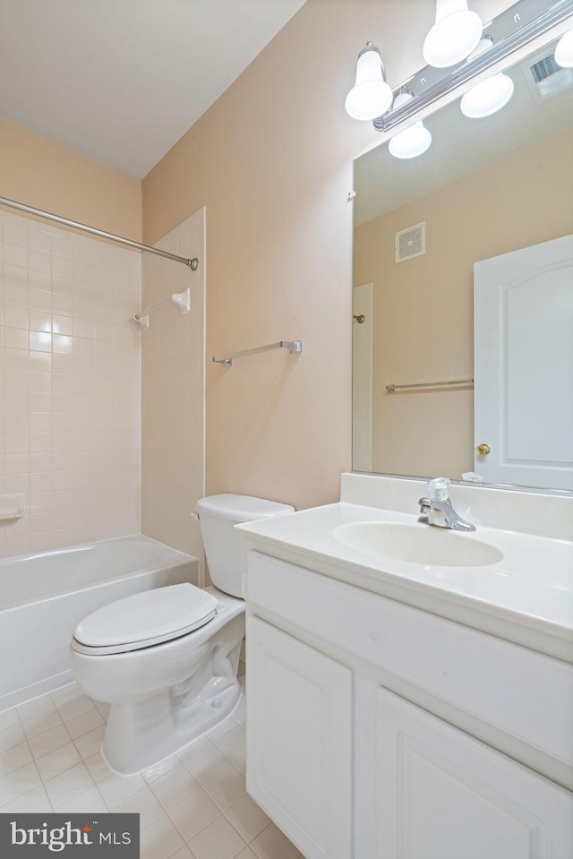 bathroom with visible vents, tile patterned flooring, toilet, and vanity