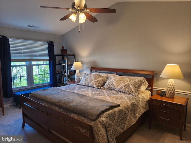 bedroom with visible vents, a ceiling fan, lofted ceiling, baseboards, and carpet flooring