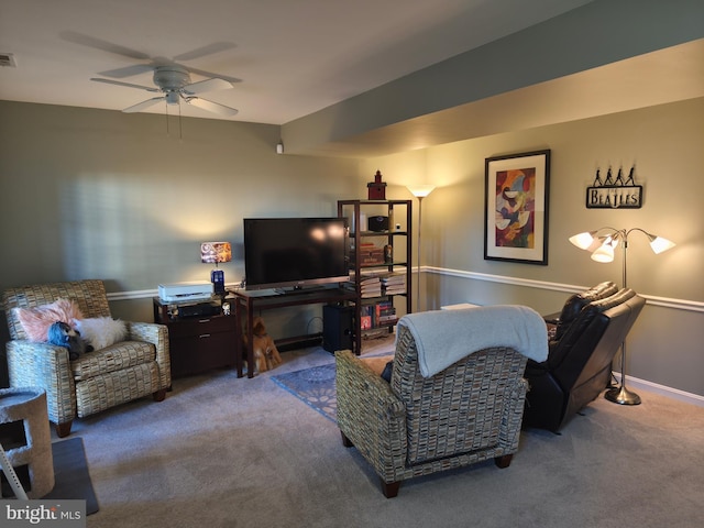 living room featuring carpet floors, a ceiling fan, and visible vents