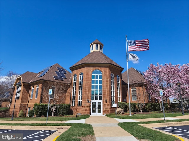 view of property featuring uncovered parking