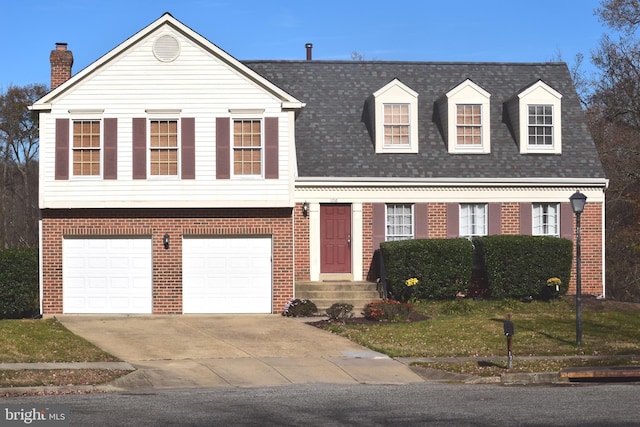 1716 Pebble Beach Dr, Bowie, MD 20721 - split level home featuring brick siding, an attached garage, driveway, and a chimney