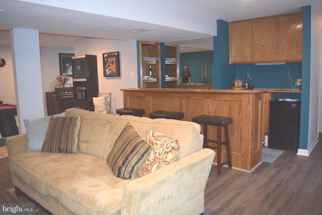 1716 Pebble Beach Dr, Bowie, MD 20721 - living area with indoor wet bar, dark wood-style flooring, baseboards, and visible vents
