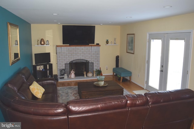 1716 Pebble Beach Dr, Bowie, MD 20721 - living room featuring recessed lighting, french doors, wood finished floors, and a fireplace