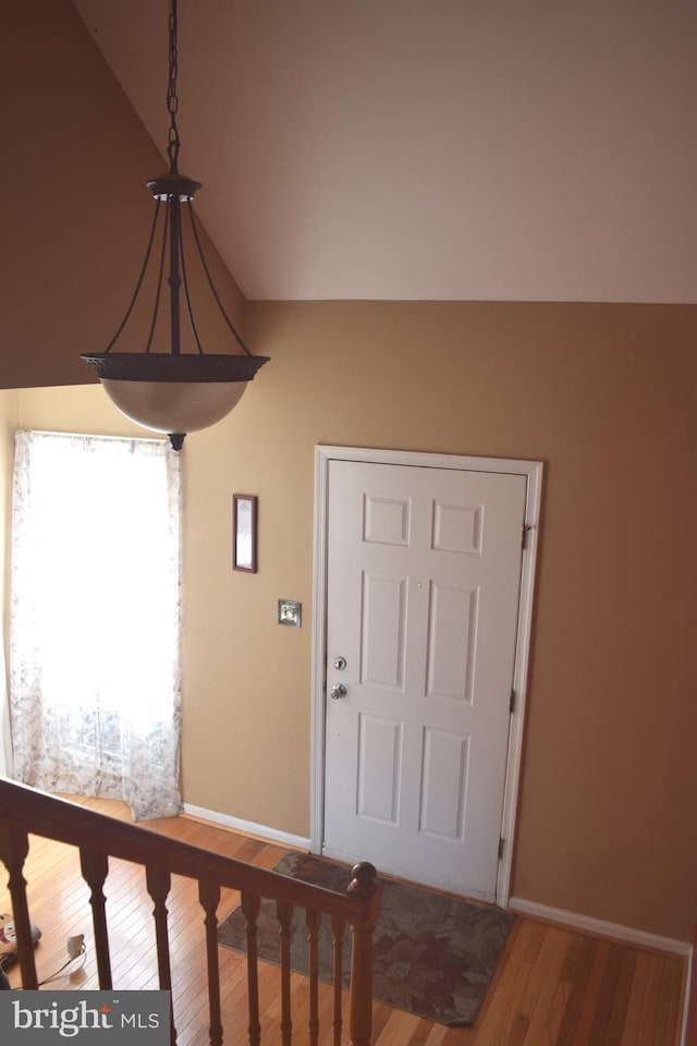 1716 Pebble Beach Dr, Bowie, MD 20721 - entrance foyer featuring baseboards, wood finished floors, and vaulted ceiling