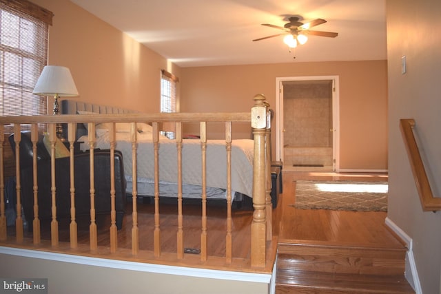 1716 Pebble Beach Dr, Bowie, MD 20721 - stairs with baseboards, a ceiling fan, and wood finished floors