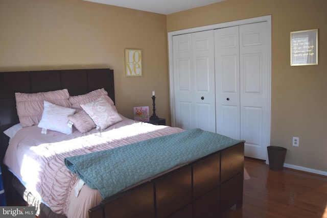 1716 Pebble Beach Dr, Bowie, MD 20721 - bedroom featuring dark wood-style flooring, baseboards, and a closet