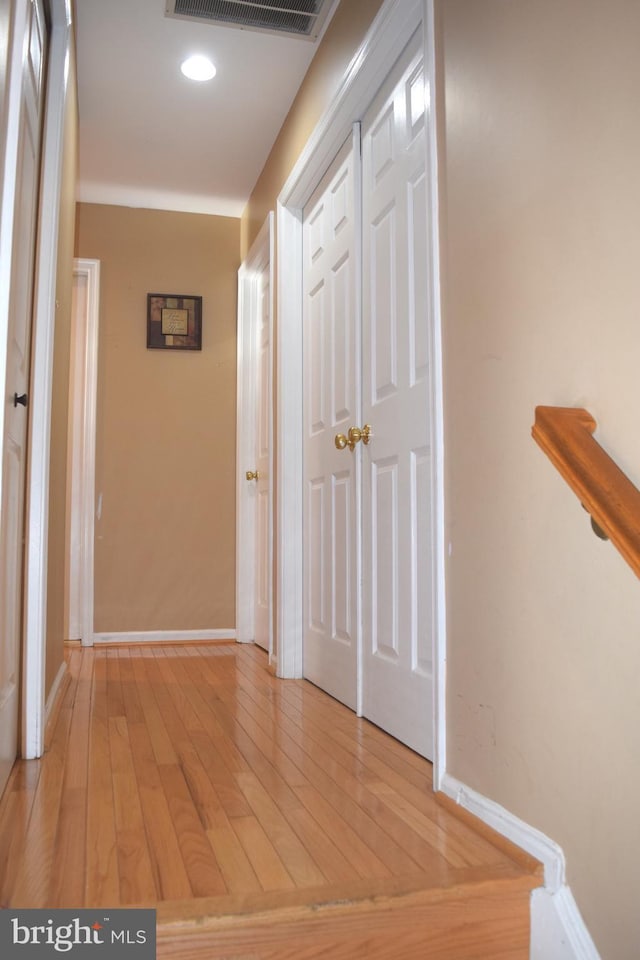 1716 Pebble Beach Dr, Bowie, MD 20721 - hall with visible vents, baseboards, and light wood-type flooring