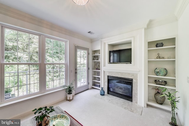 5922 Terrapin Pl Unit 5922, Alexandria, VA 22310 - living room featuring carpet, built in features, a high end fireplace, ornamental molding, and healthy amount of natural light