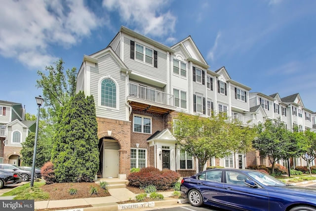 5922 Terrapin Pl Unit 5922, Alexandria, VA 22310 - view of property featuring brick siding, a residential view, and uncovered parking