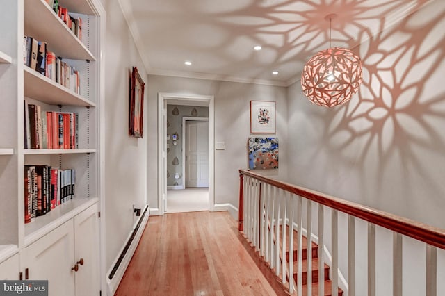 corridor featuring crown molding, recessed lighting, a baseboard radiator, light wood finished floors, and an upstairs landing