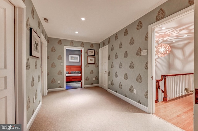 interior space with visible vents, crown molding, recessed lighting, baseboards, and wallpapered walls