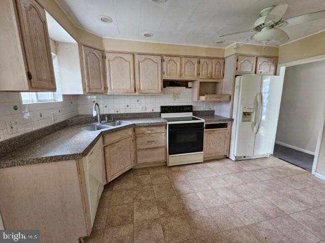 kitchen with backsplash, dark countertops, light brown cabinetry, a sink, and white appliances