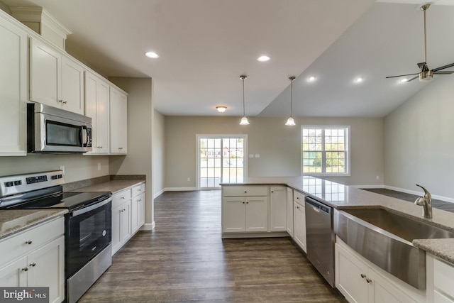 7826 Sugar Maple Dr, Milford, DE 19963 - kitchen with a sink, appliances with stainless steel finishes, dark wood-style floors, and white cabinetry