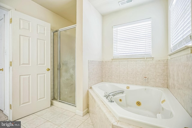 full bath featuring a whirlpool tub, visible vents, tile patterned flooring, and a shower stall