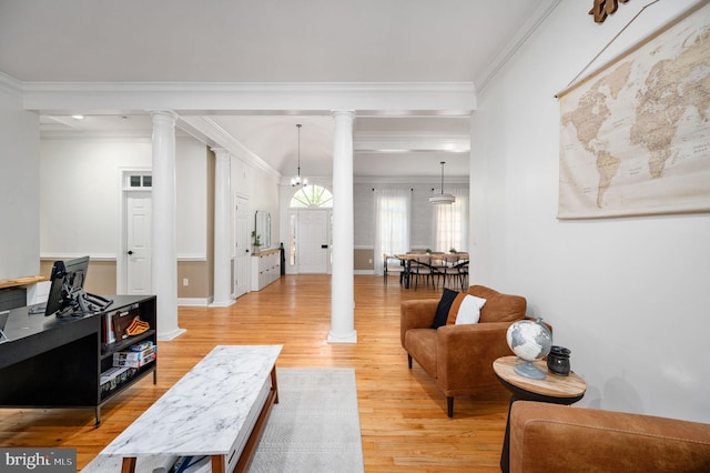 living room with baseboards, decorative columns, ornamental molding, and light wood-style flooring
