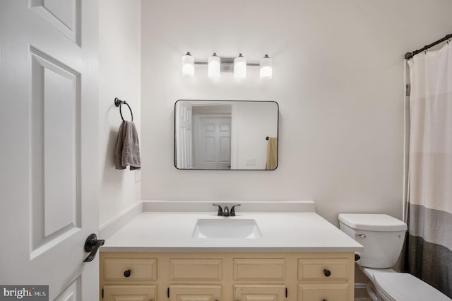 full bathroom featuring vanity and toilet
