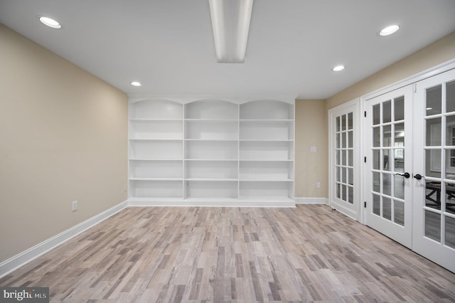 unfurnished room with baseboards, french doors, recessed lighting, and wood finished floors