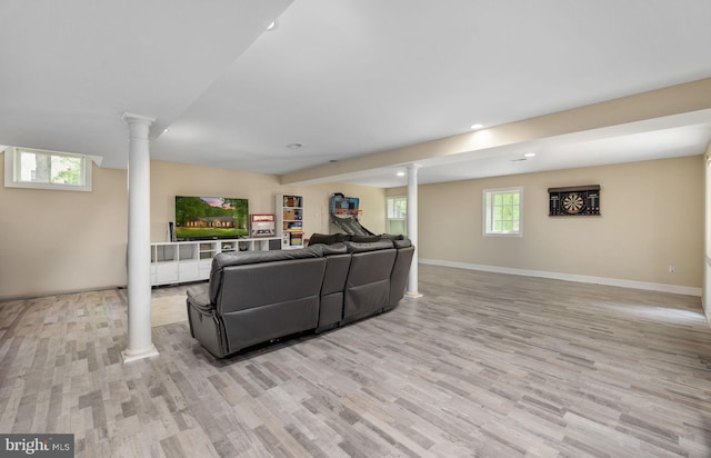living room with baseboards, decorative columns, recessed lighting, and light wood-style flooring