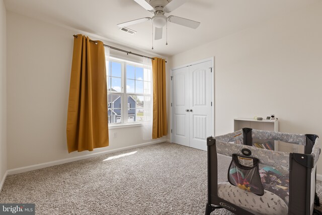 office with carpet floors, baseboards, visible vents, and ceiling fan