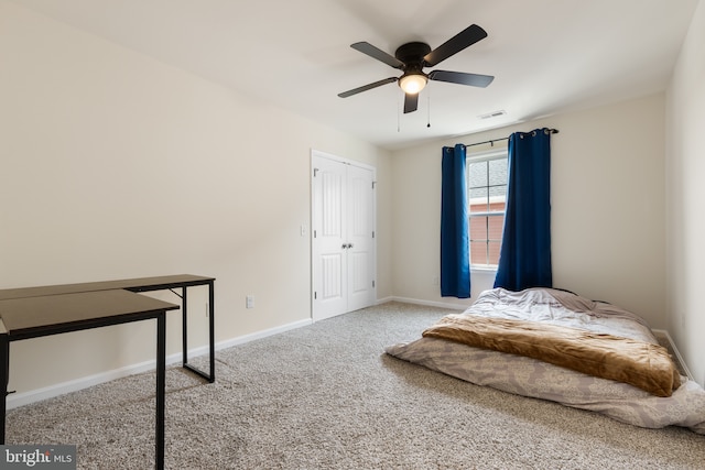 carpeted bedroom with a ceiling fan, baseboards, and visible vents