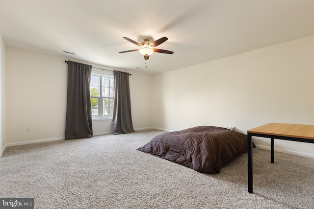 bedroom featuring visible vents, carpet flooring, baseboards, and ceiling fan