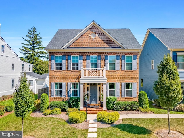 52 Primrose Hill Ln, Annapolis, MD 21403 - colonial inspired home with brick siding, a front lawn, and roof with shingles