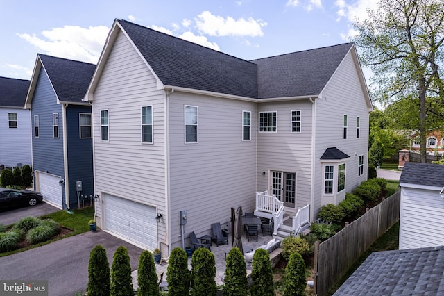 52 Primrose Hill Ln, Annapolis, MD 21403 - view of home's exterior with driveway, an attached garage, fence, and roof with shingles