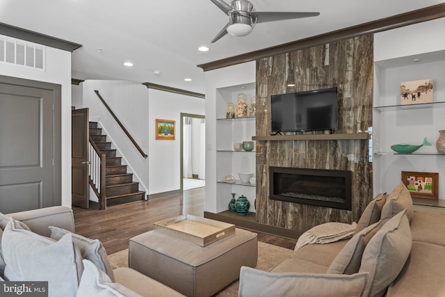52 Primrose Hill Ln, Annapolis, MD 21403 - living room with wood finished floors, stairway, a ceiling fan, built in features, and recessed lighting