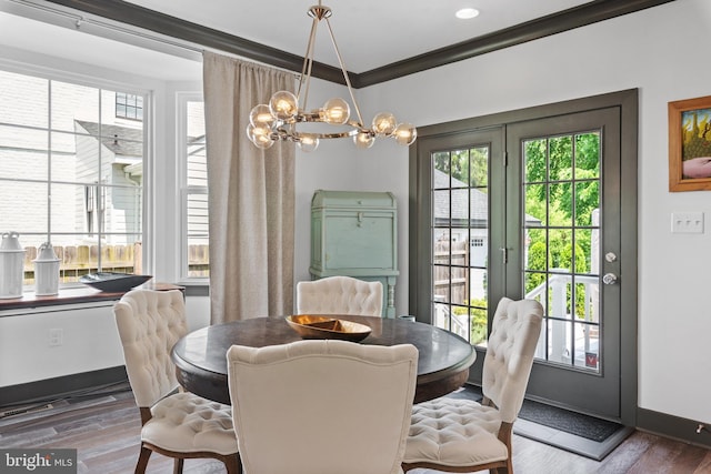 52 Primrose Hill Ln, Annapolis, MD 21403 - dining area featuring a chandelier, wood finished floors, baseboards, and crown molding