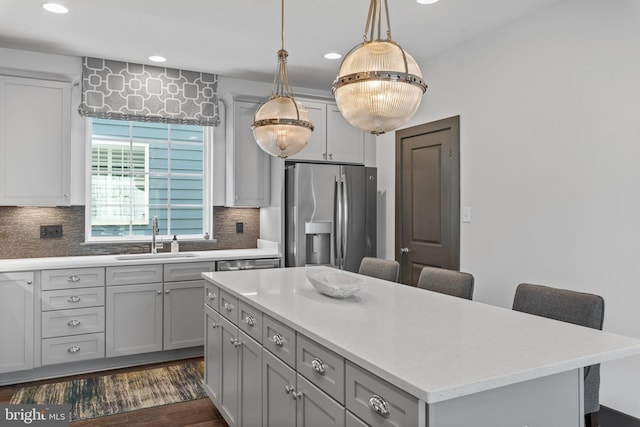 52 Primrose Hill Ln, Annapolis, MD 21403 - kitchen featuring a sink, stainless steel fridge, a breakfast bar area, gray cabinetry, and recessed lighting