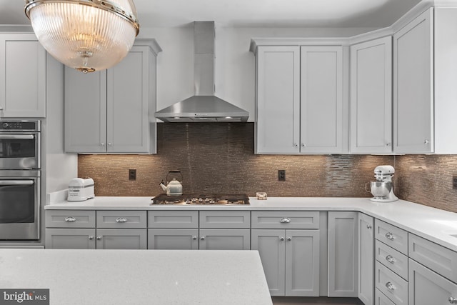 52 Primrose Hill Ln, Annapolis, MD 21403 - kitchen featuring wall chimney exhaust hood, appliances with stainless steel finishes, light countertops, and backsplash