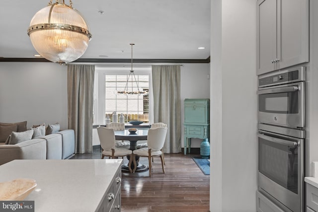 52 Primrose Hill Ln, Annapolis, MD 21403 - kitchen with double oven, a chandelier, ornamental molding, light countertops, and gray cabinets
