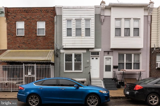 view of property with brick siding