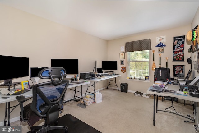carpeted home office with baseboards