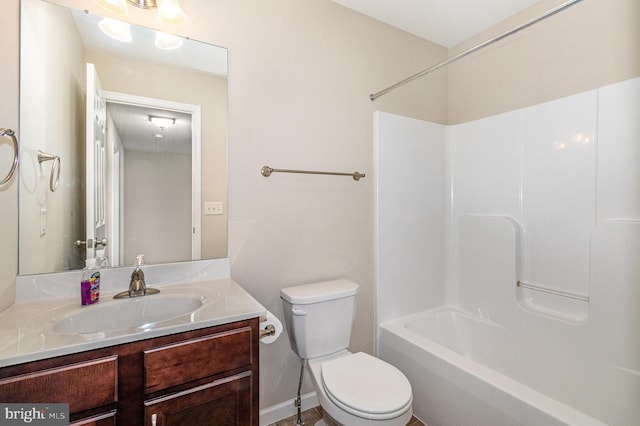 bathroom featuring toilet and vanity