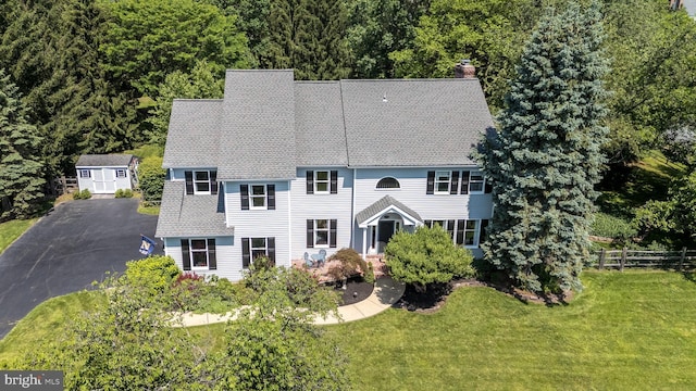 4690 Derby Ln, Doylestown, PA 18902 - colonial-style house with a chimney, a shingled roof, asphalt driveway, and a storage shed