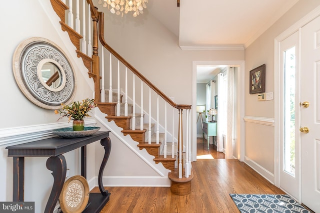4690 Derby Ln, Doylestown, PA 18902 - foyer with wood finished floors, stairs, ornamental molding, and a chandelier