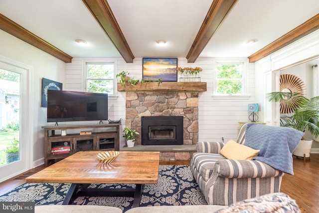 4690 Derby Ln, Doylestown, PA 18902 - living area with beamed ceiling, healthy amount of natural light, a stone fireplace, and wood finished floors