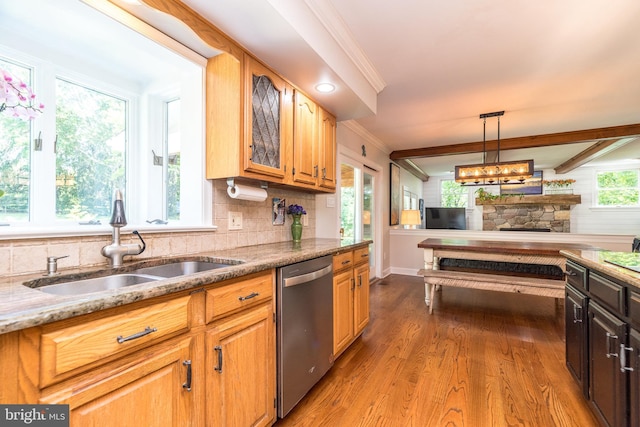 4690 Derby Ln, Doylestown, PA 18902 - kitchen with dishwasher, wood finished floors, decorative backsplash, crown molding, and a fireplace
