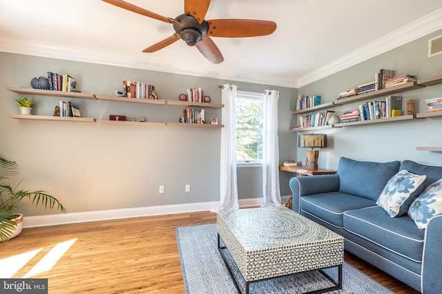4690 Derby Ln, Doylestown, PA 18902 - living area featuring wood finished floors, crown molding, and a ceiling fan