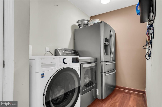 317 Nicholas, Wilmington, DE 19808 - clothes washing area with separate washer and dryer, wood finished floors, and baseboards