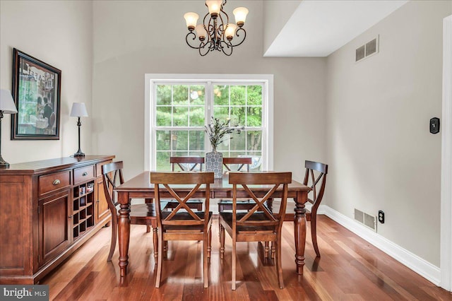 317 Nicholas, Wilmington, DE 19808 - dining area with a chandelier, light wood finished floors, and baseboards