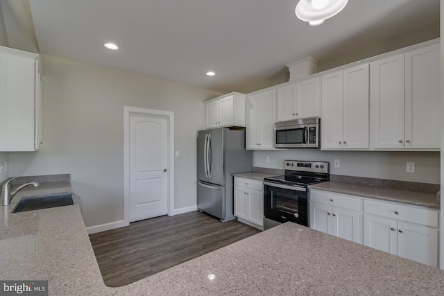 7826B Sugar Maple Dr, Milford, DE 19963 - kitchen featuring a sink, appliances with stainless steel finishes, and white cabinets