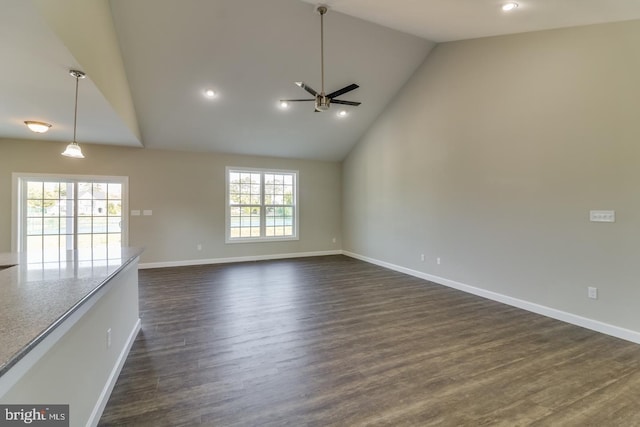 7826B Sugar Maple Dr, Milford, DE 19963 - unfurnished living room featuring ceiling fan, baseboards, high vaulted ceiling, and dark wood-type flooring
