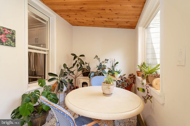 dining area featuring wooden ceiling
